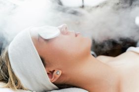 Young,Woman,Receiving,Beauty,Treatment,With,Thermal,Ozone,Facial,Steamer.